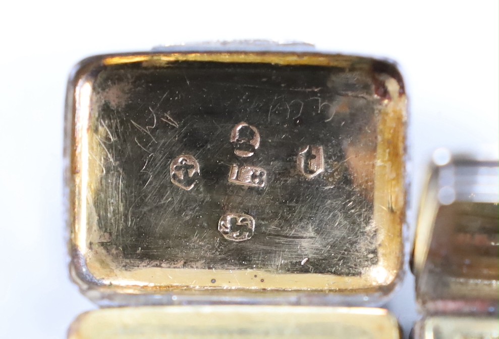 A George IV silver rectangular vinaigrette, John Shaw, Birmingham, 1826 (a.f.) and an earlier silver vinaigrette with acorn decorated cover, Birmingham, 1817.